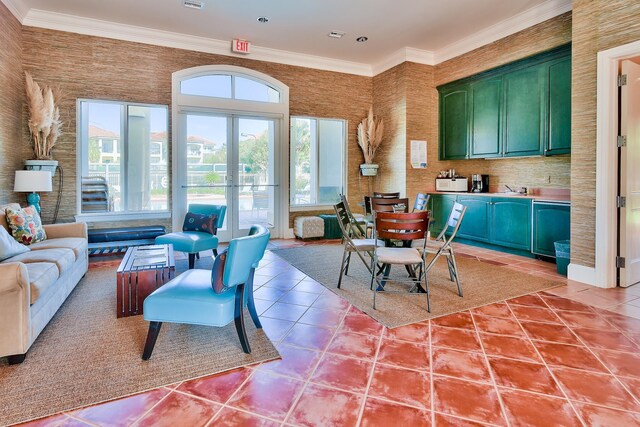 431 La Valencia Cir, Panama City Beach, FL 32413 - kitchen featuring green cabinetry, light tile patterned floors, open floor plan, ornamental molding, and french doors