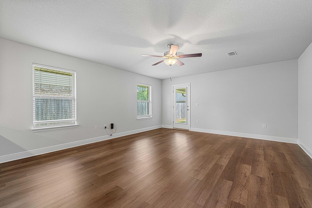 103 Ridgeway Cir, Crestview, FL 32536 - empty room with ceiling fan, dark wood-style floors, baseboards, and a textured ceiling