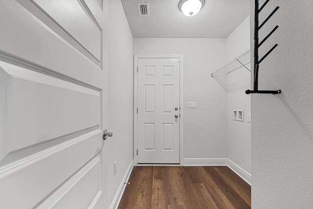 103 Ridgeway Cir, Crestview, FL 32536 - washroom with hookup for a washing machine, dark wood-style floors, baseboards, and a textured ceiling