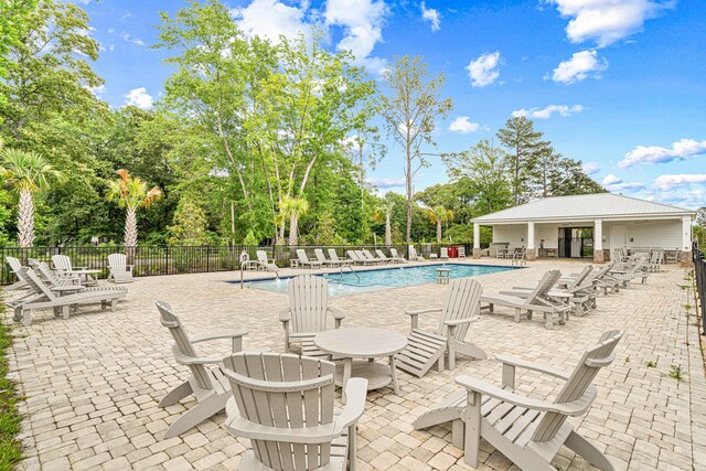 103 Ridgeway Cir, Crestview, FL 32536 - community pool featuring view of scattered trees and a patio