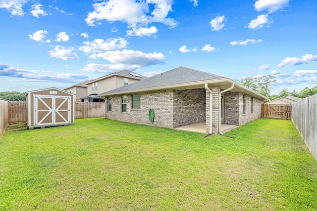 103 Ridgeway Cir, Crestview, FL 32536 - rear view of house with brick siding, a patio, and a shingled roof