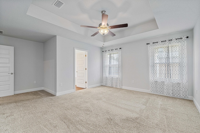 103 Ridgeway Cir, Crestview, FL 32536 - carpeted spare room featuring a raised ceiling, ceiling fan, and baseboards