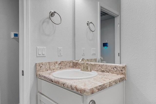 103 Ridgeway Cir, Crestview, FL 32536 - bathroom with vanity and a textured wall