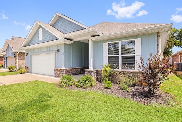 20 6th Ave, Shalimar, FL 32579 - craftsman inspired home with board and batten siding, an attached garage, a front lawn, and driveway