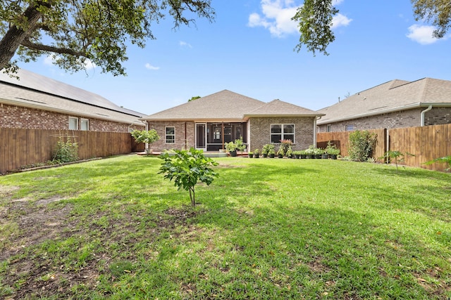 20 6th Ave, Shalimar, FL 32579 - back of property with a sunroom and brick siding