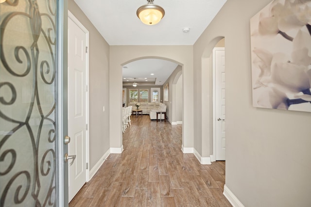 20 6th Ave, Shalimar, FL 32579 - foyer entrance with arched walkways, wood finished floors, and baseboards