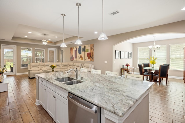 20 6th Ave, Shalimar, FL 32579 - kitchen with dishwasher, a sink, wood tiled floors, arched walkways, and recessed lighting