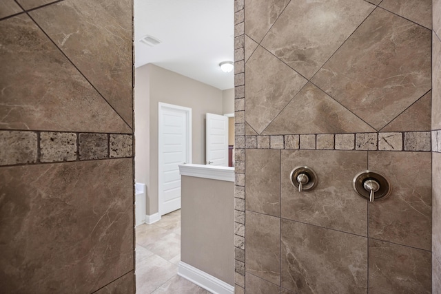 20 6th Ave, Shalimar, FL 32579 - bathroom with tiled shower and tile patterned flooring