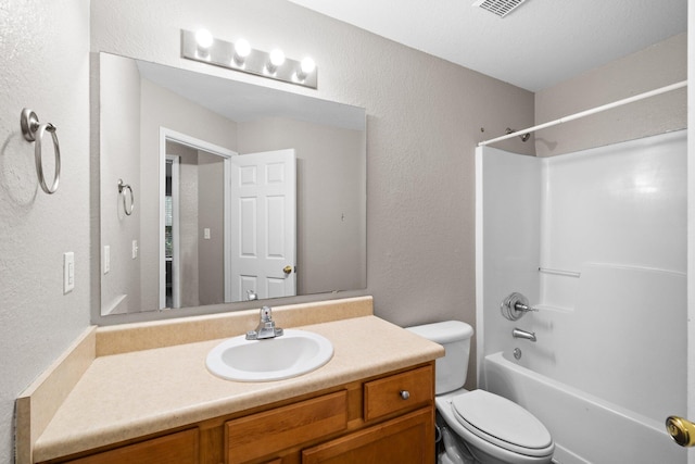 1014 Airport Rd Unit 155, Destin, FL 32541 - bathroom with vanity, toilet, bathtub / shower combination, and a textured wall
