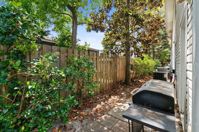 1014 Airport Rd Unit 155, Destin, FL 32541 - fenced backyard featuring cooling unit and a patio