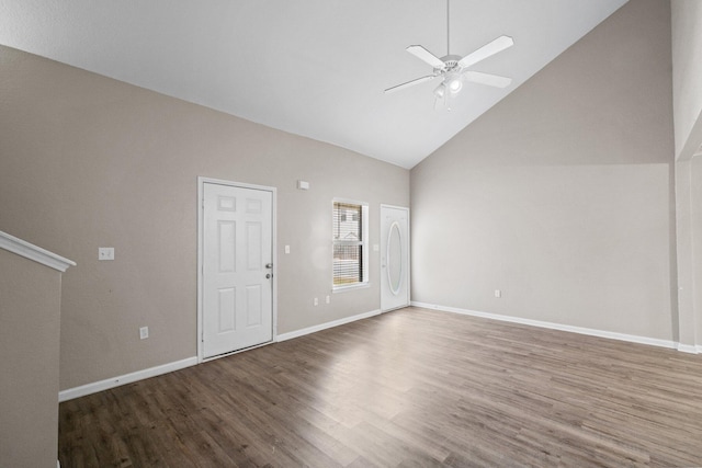 1014 Airport Rd Unit 155, Destin, FL 32541 - unfurnished living room with wood finished floors, high vaulted ceiling, ceiling fan, and baseboards