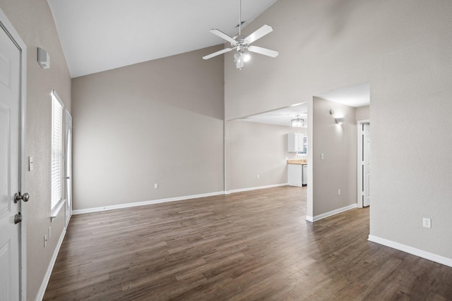 1014 Airport Rd Unit 155, Destin, FL 32541 - unfurnished living room featuring high vaulted ceiling, ceiling fan, wood finished floors, and baseboards