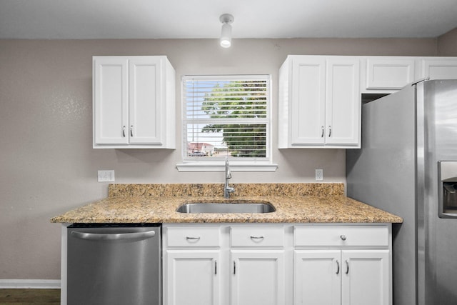 1014 Airport Rd Unit 155, Destin, FL 32541 - kitchen featuring appliances with stainless steel finishes, a sink, and white cabinetry