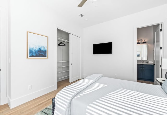 205 Redbud Ln, Inlet Beach, FL 32461 - bedroom with a closet, wood finished floors, baseboards, connected bathroom, and a ceiling fan