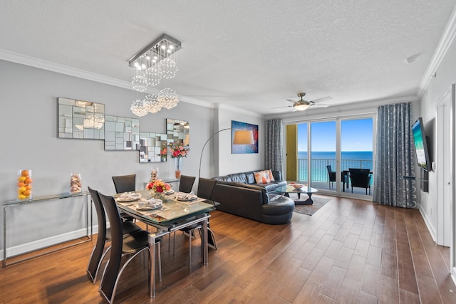 17545 Front Beach Rd Unit 1301, Panama City Beach, FL 32413 - dining room featuring ornamental molding, a textured ceiling, wood finished floors, ceiling fan, and a chandelier