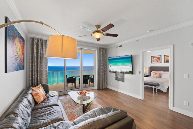 17545 Front Beach Rd Unit 1301, Panama City Beach, FL 32413 - living area with wood finished floors, crown molding, baseboards, and a ceiling fan