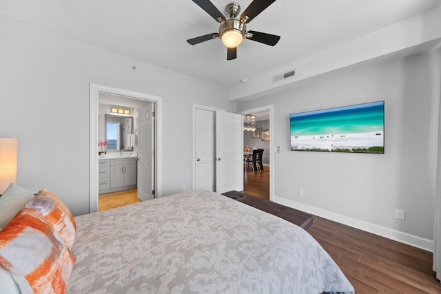 17545 Front Beach Rd Unit 1301, Panama City Beach, FL 32413 - bedroom featuring wood finished floors, baseboards, connected bathroom, and ceiling fan
