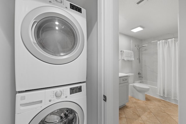 17545 Front Beach Rd Unit 1301, Panama City Beach, FL 32413 - laundry room with stacked washer / drying machine and light tile patterned floors
