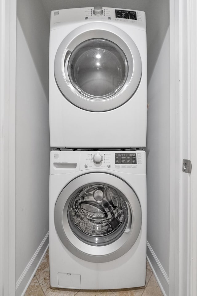 17545 Front Beach Rd Unit 1301, Panama City Beach, FL 32413 - laundry room featuring stacked washer / drying machine and baseboards