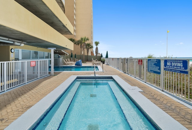 17545 Front Beach Rd Unit 1301, Panama City Beach, FL 32413 - community pool with a patio
