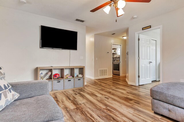1951 Ambassador Dr, Gulf Breeze, FL 32563 - living area with a ceiling fan, light wood finished floors, and baseboards