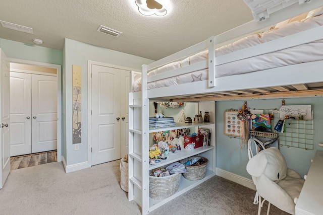 8726 Brown Pelican Cir, Navarre, FL 32566 - bedroom with carpet flooring, baseboards, and a textured ceiling