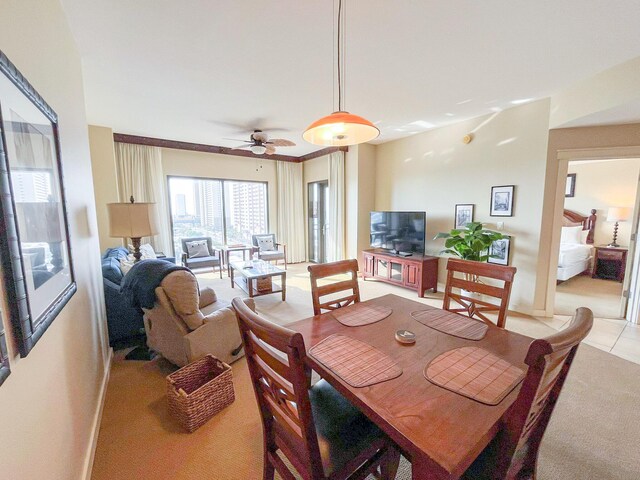 15100 Front Beach Rd Unit 831, Panama City Beach, FL 32413 - dining area with baseboards, ceiling fan, light colored carpet, and light tile patterned floors