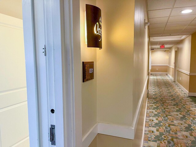 15100 Front Beach Rd Unit 831, Panama City Beach, FL 32413 - hall with baseboards, a drop ceiling, recessed lighting, and stone finish floors