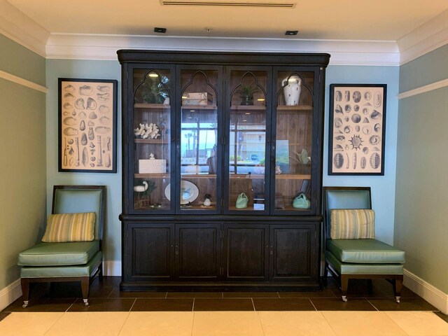 15100 Front Beach Rd Unit 831, Panama City Beach, FL 32413 - living area featuring ornamental molding, baseboards, and tile patterned flooring