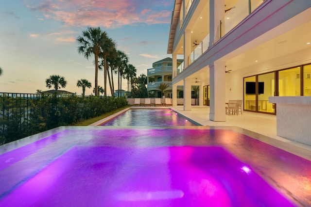 4658 Destiny Way, Destin, FL 32541 - pool at dusk with a patio and a pool with connected hot tub