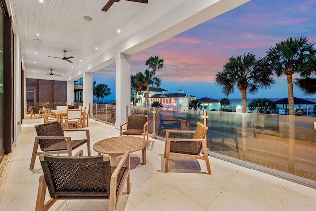 4658 Destiny Way, Destin, FL 32541 - patio terrace at dusk with ceiling fan, outdoor dining space, and a patio area