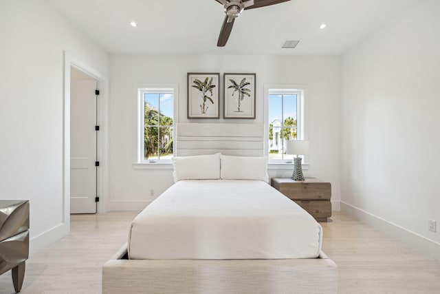 4658 Destiny Way, Destin, FL 32541 - bedroom with multiple windows, baseboards, light wood-type flooring, recessed lighting, and ceiling fan