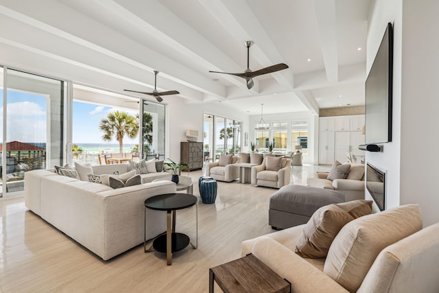 4658 Destiny Way, Destin, FL 32541 - living room featuring beam ceiling, ceiling fan, a water view, and light wood-style floors