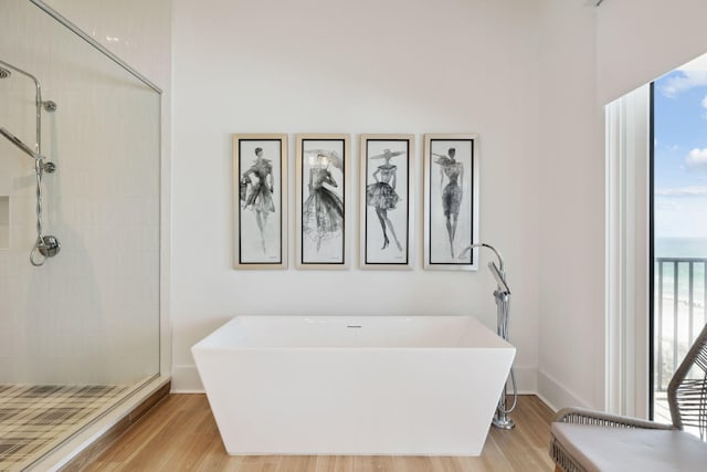 3464 Scenic Highway 98, Destin, FL 32541 - bathroom with a freestanding bath, tiled shower, and wood finished floors