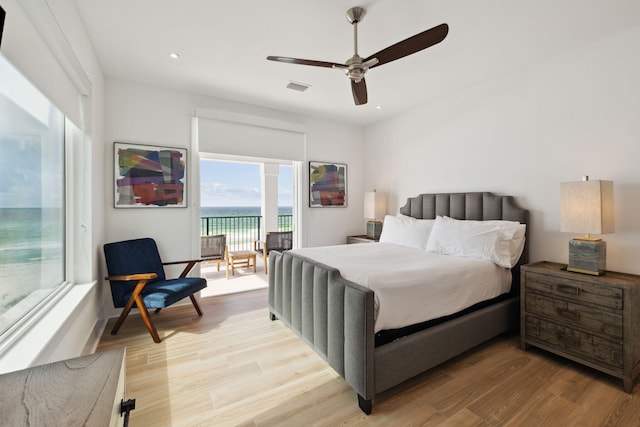 3464 Scenic Highway 98, Destin, FL 32541 - bedroom featuring access to exterior, light wood finished floors, recessed lighting, ceiling fan, and a water view