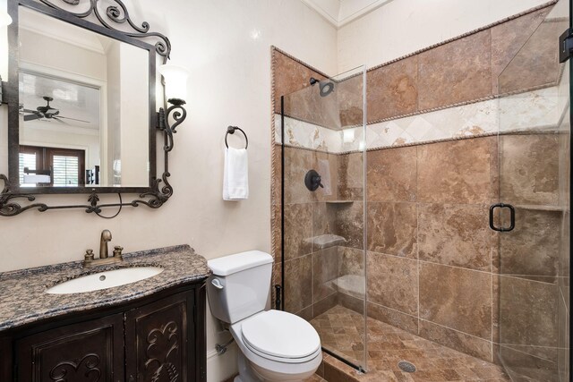 17 Saint Martin Cir, Miramar Beach, FL 32550 - full bathroom featuring toilet, a stall shower, vanity, and ceiling fan