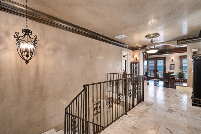 17 Saint Martin Cir, Miramar Beach, FL 32550 - hallway with an upstairs landing, a chandelier, and crown molding