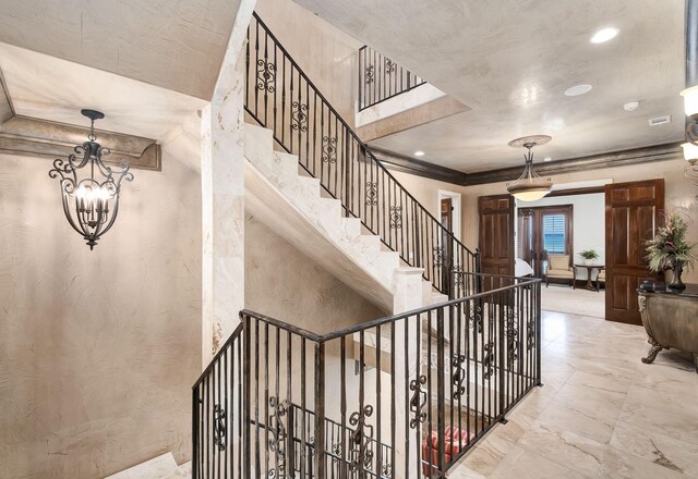 17 Saint Martin Cir, Miramar Beach, FL 32550 - stairway with recessed lighting, a textured wall, and ornamental molding