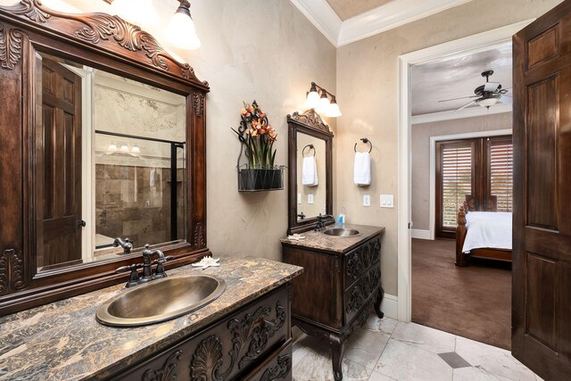 17 Saint Martin Cir, Miramar Beach, FL 32550 - ensuite bathroom with ceiling fan, two vanities, a stall shower, baseboards, and ornamental molding