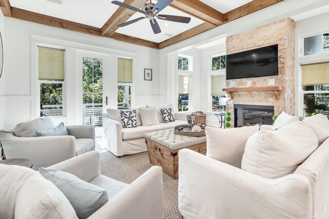 18 Eastern Lake Ct, Santa Rosa Beach, FL 32459 - living area with ceiling fan, beamed ceiling, a stone fireplace, and coffered ceiling