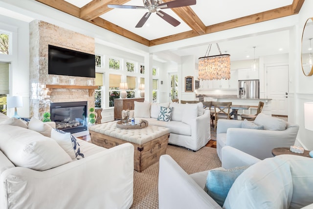 18 Eastern Lake Ct, Santa Rosa Beach, FL 32459 - living area featuring a ceiling fan, beamed ceiling, a fireplace, coffered ceiling, and wood finished floors