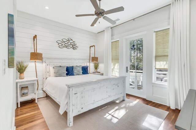 18 Eastern Lake Ct, Santa Rosa Beach, FL 32459 - bedroom featuring access to exterior, wood finished floors, wooden walls, a ceiling fan, and recessed lighting