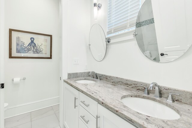 18 Eastern Lake Ct, Santa Rosa Beach, FL 32459 - full bath featuring toilet, marble look tile flooring, double vanity, and a tile shower