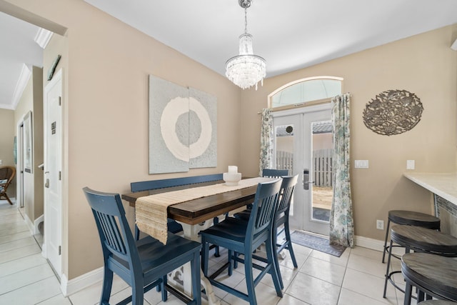 34 Opal Cv, Miramar Beach, FL 32550 - dining space featuring french doors, a chandelier, light tile patterned flooring, and baseboards