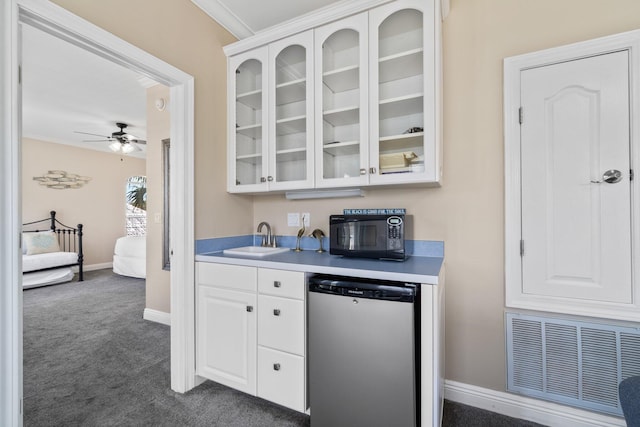34 Opal Cv, Miramar Beach, FL 32550 - bar featuring dishwashing machine, a sink, dark colored carpet, ceiling fan, and baseboards