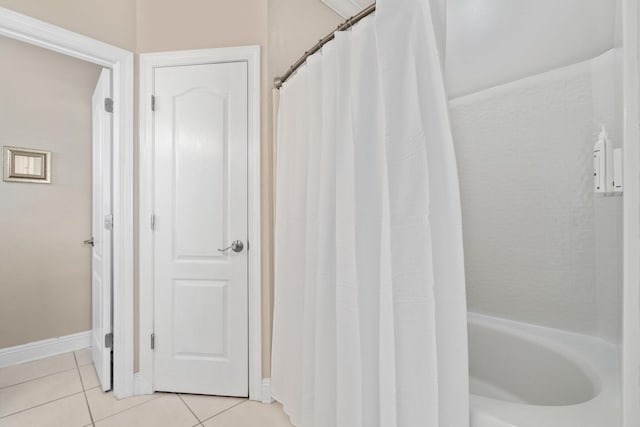 34 Opal Cv, Miramar Beach, FL 32550 - bathroom featuring tile patterned flooring, baseboards, and shower / tub combo