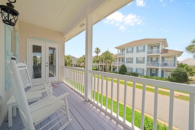 34 Opal Cv, Miramar Beach, FL 32550 - wooden deck with french doors