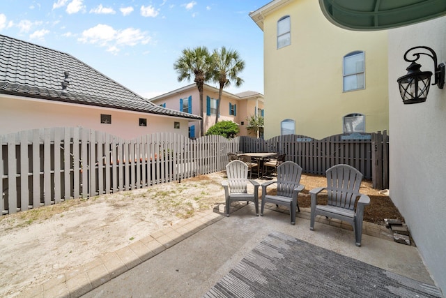 34 Opal Cv, Miramar Beach, FL 32550 - fenced backyard with a patio area and outdoor dining area