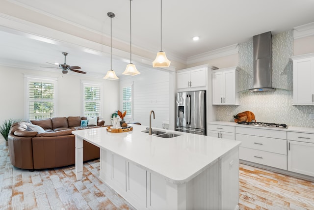 164 Clipper St, Inlet Beach, FL 32461 - kitchen with stainless steel appliances, a sink, wall chimney exhaust hood, decorative backsplash, and light countertops