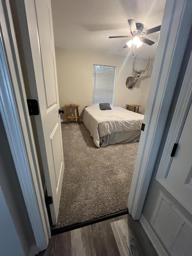 8945 Bluebell St, Milton, FL 32583 - bedroom featuring dark carpet and ceiling fan